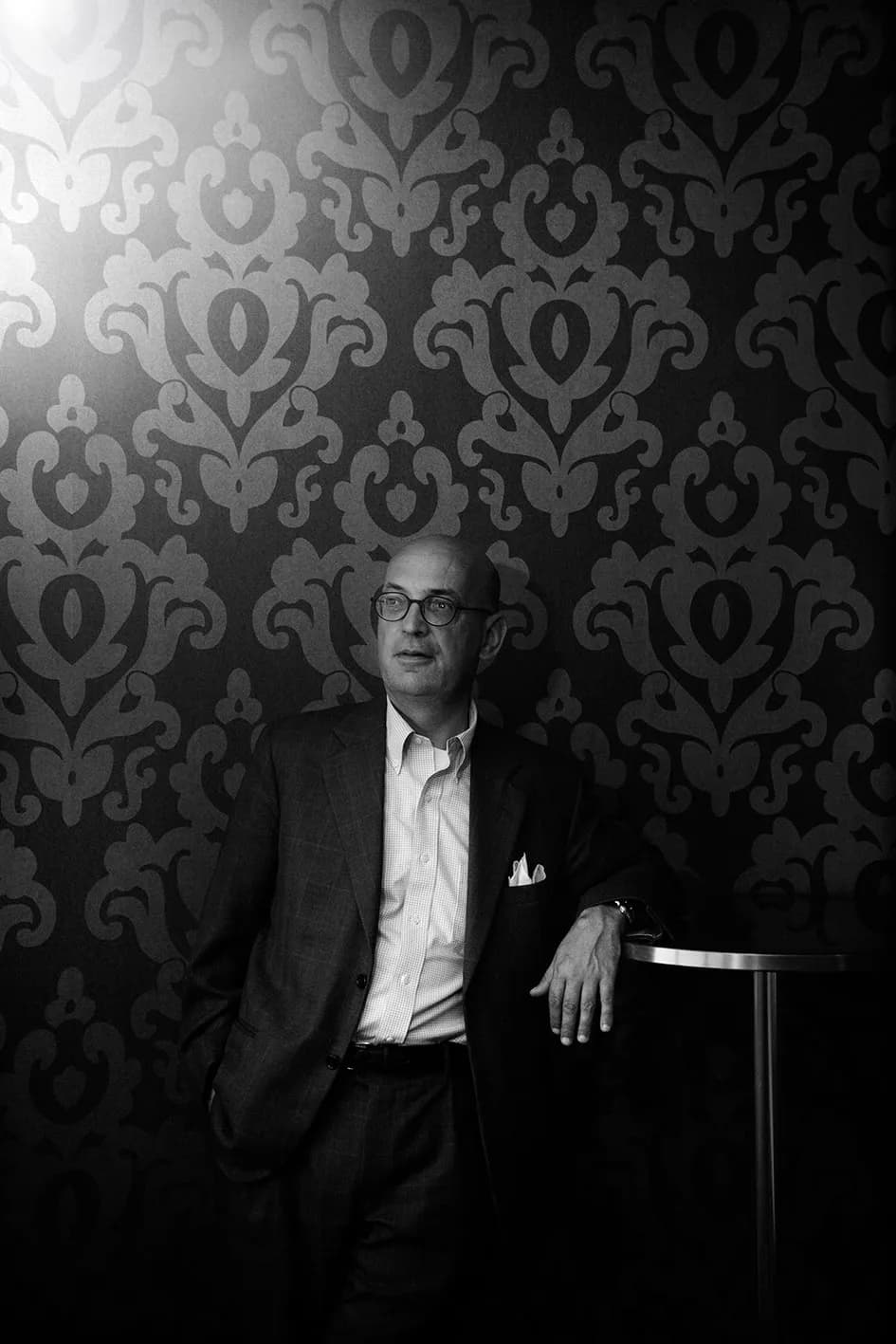 Professional business portrait with confident posture in a corporate office environment